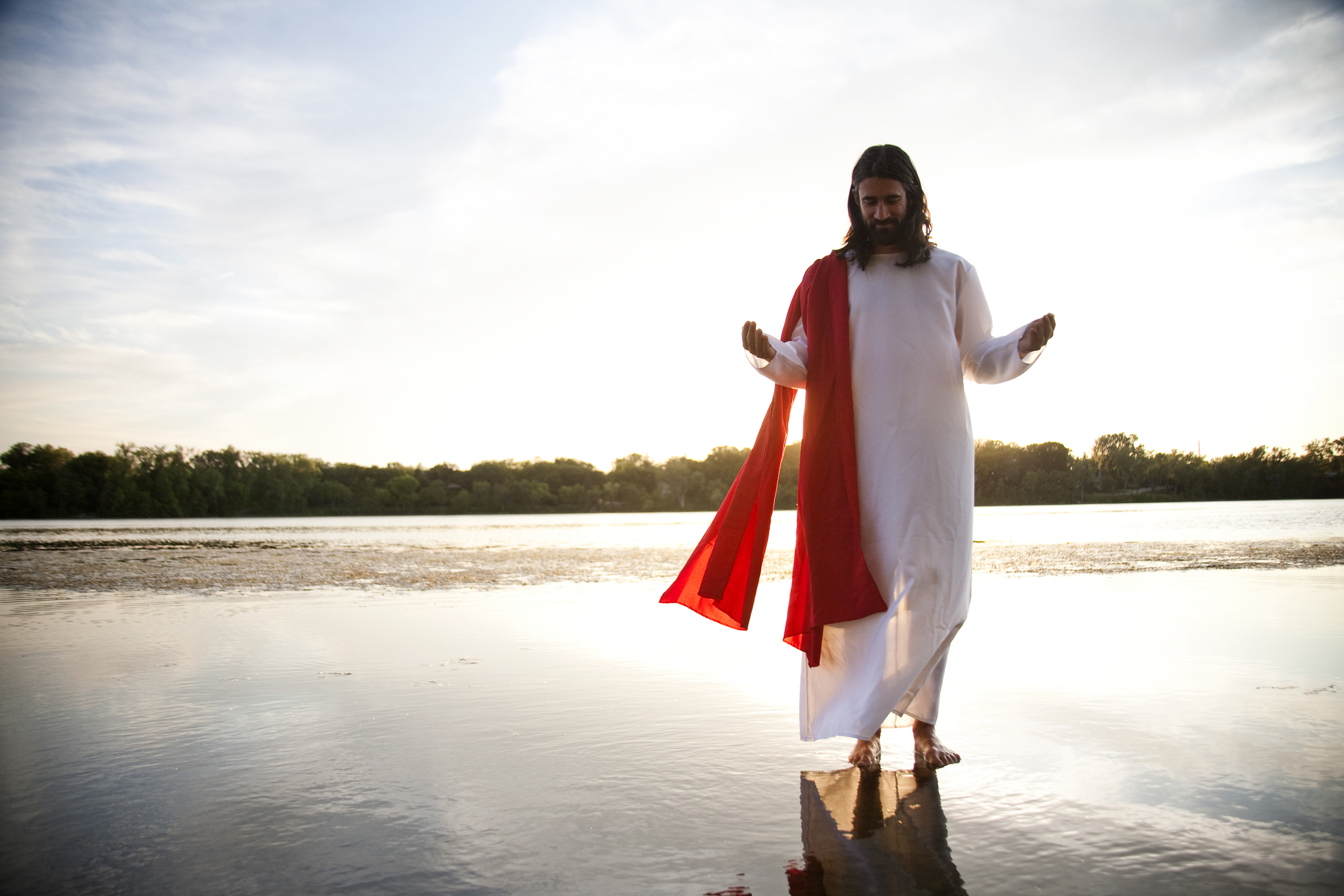 Man dressed up as Jesus on water.
