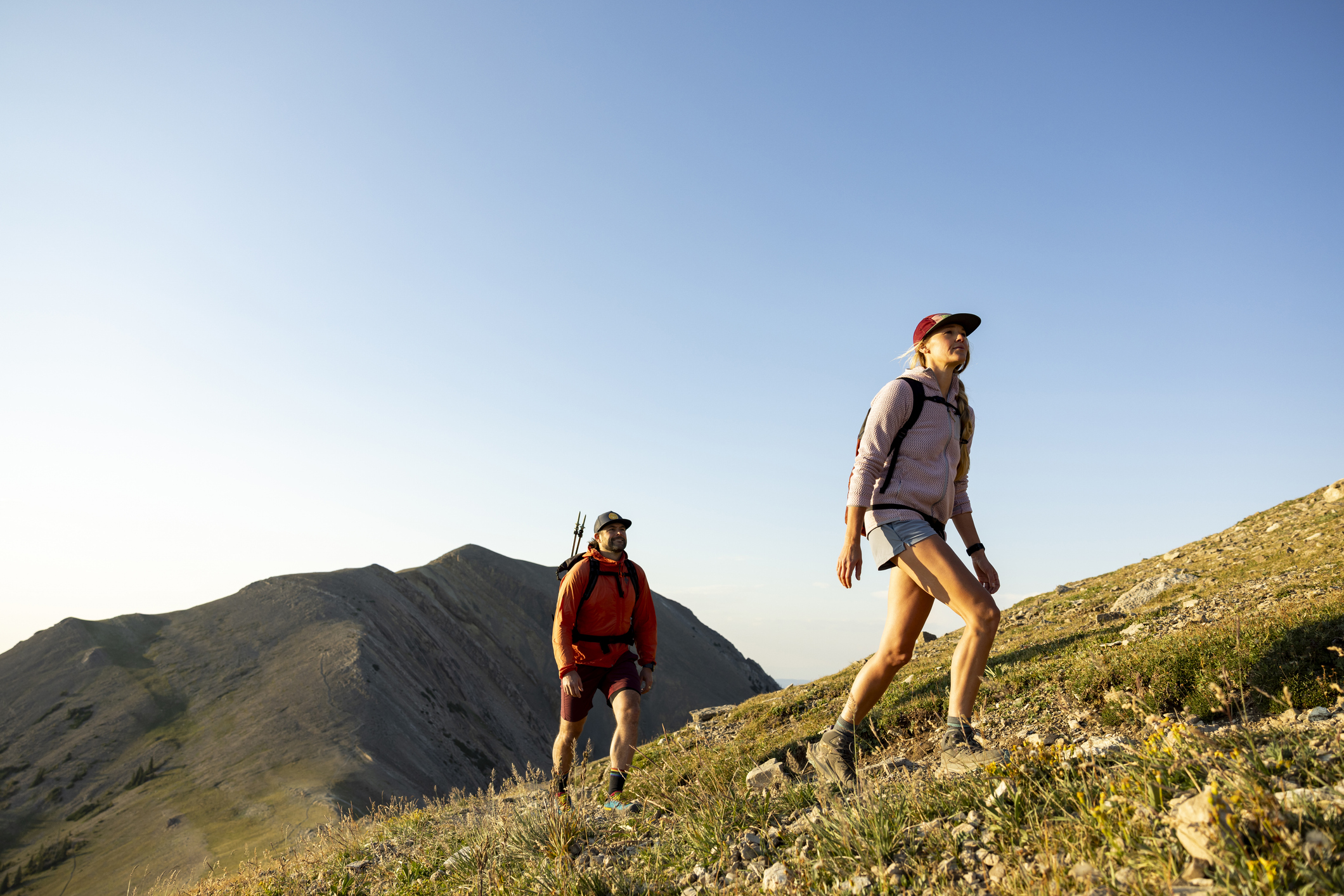 A couple enjoying a day hike in the scenic mountains of Montana.