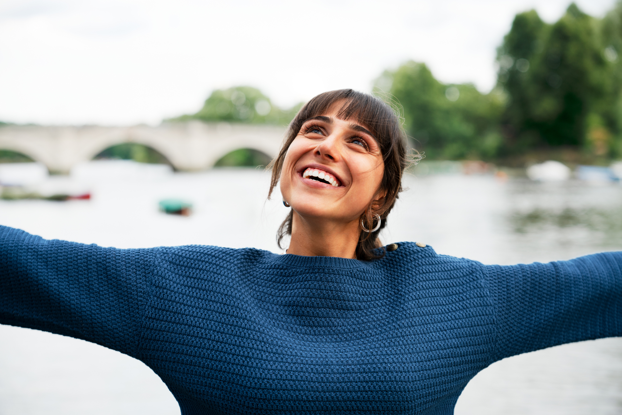 Happy woman with arms outstretched