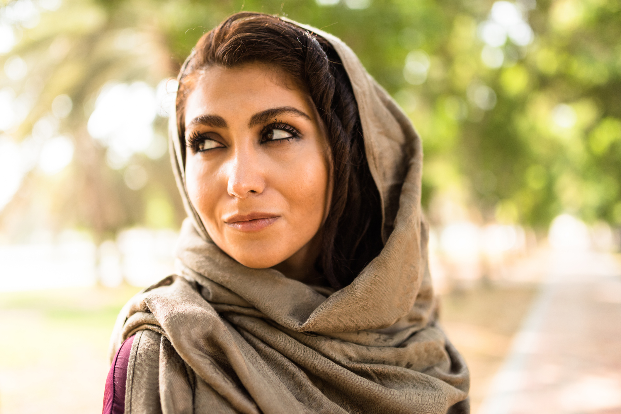 arabic woman in the park in abu dhabi - uae