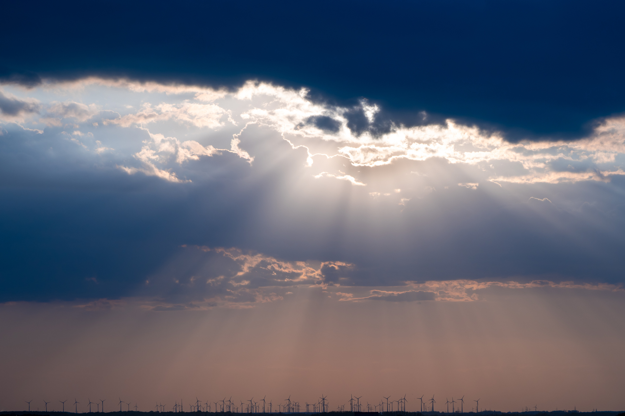 Rays of light shining through dark clouds